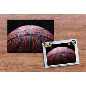 Puzzel Een Basketbal op een zwarte achtergrond - Legpuzzel - Puzzel 500 stukjes