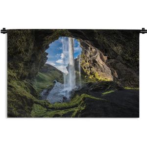 Wandkleed IJsland  - Waterval buiten een grot in Ijsland Wandkleed katoen 150x100 cm - Wandtapijt met foto
