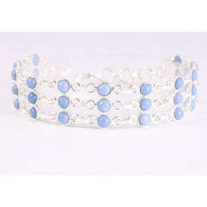Brede zilveren schakelarmband met blauwe opaal