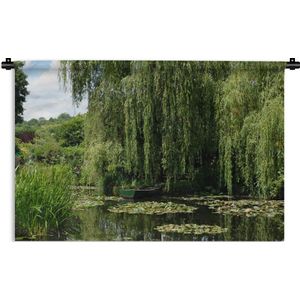 Wandkleed Monet's tuin - Waterlelies in het water met hangende boomtakken boven het water in Frankrijk Wandkleed katoen 90x60 cm - Wandtapijt met foto