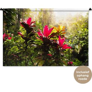 Wandkleed Jungle - Prachtige bloemen middenin de jungle Wandkleed katoen 120x80 cm - Wandtapijt met foto