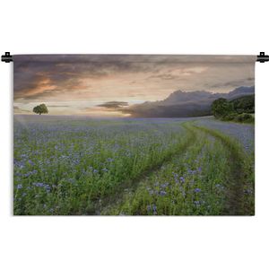 Wandkleed Bloemenvelden - Blauwe en paarse bloemen zonsondergang Wandkleed katoen 150x100 cm - Wandtapijt met foto
