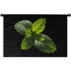 Wandkleed Planten op een zwarte achtergrond - Een close-up van muntbladeren tegen een zwarte achtergrond Wandkleed katoen 120x80 cm - Wandtapijt met foto