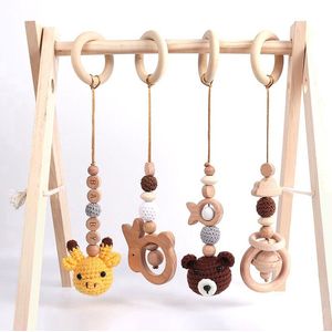Babygym - inclusief vier speeltjes - Babygym hout - kraamcadeau jongen en meisje - baby cadeau - speelplezier
