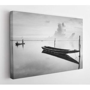 Black and white scene of a traditional fishing boat in Tumpat, Malaysia, with the silhouette of the fisherman standing on the boat. Soft focus due to long exposure - Modern Art Canvas - Horizontal - 746061157 - 50*40 Horizontal