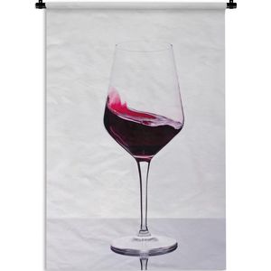 Wandkleed Rode wijn - Studio shot van een glas Rode wijn Wandkleed katoen 60x90 cm - Wandtapijt met foto