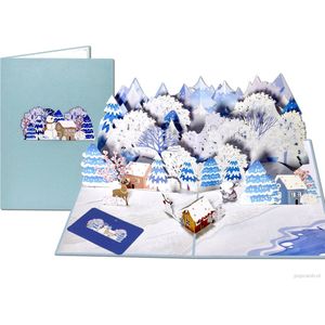 Popcards popupkaarten – Schitterende imposante Kerstkaart met besneeuwd landschap, bergen, sfeervolle huisjes, rendier & sneeuwpop pop-up kaart kerst 3D wenskaart