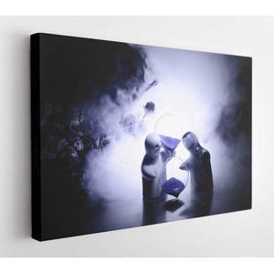 Two doll hugging on table with flowers and moon decoration Lighted background with smoke.Love concept. Greeting or gift card design idea. Silhouette of hugging couple - Modern Art Canvas - Horizontal - 631025162 - 50*40 Horizontal