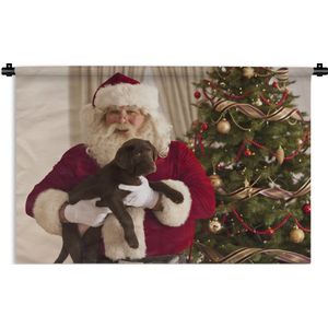 Wandkleed Kerst - De kerstman met een bruine hond in zijn handen Wandkleed katoen 120x80 cm - Wandtapijt met foto