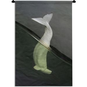 Wandkleed Zeedieren - Witte dolfijn die het water in duikt Wandkleed katoen 60x90 cm - Wandtapijt met foto