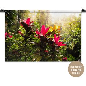 Wandkleed Jungle - Prachtige bloemen middenin de jungle Wandkleed katoen 60x40 cm - Wandtapijt met foto