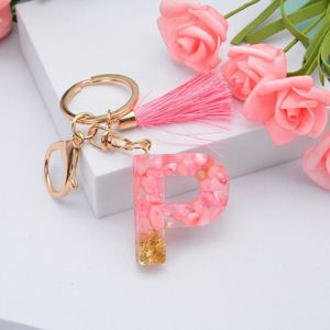 Sleutelhangers of voor je tas van A tot Z - met een pompon of kwastje - met letter - mooi design - handgemaakt - sleutelhangers - design - mode - goud - zwart - blauw - roze- rood - luxe - vlinder