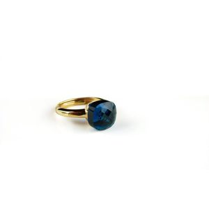 Ring in zilver geelgoud verguld model pomellato donker blauwe steen