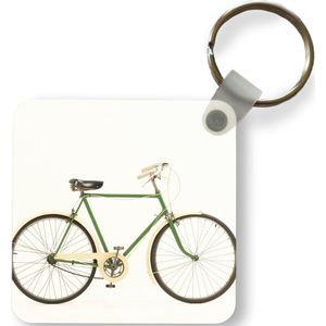 Sleutelhanger - Een groene unieke fiets - Plastic - Rond - Uitdeelcadeautjes