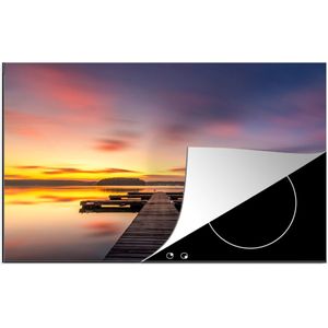 KitchenYeah® Inductie beschermer 81.2x52 cm - Steiger - Zonsondergang - Water - Zee - Reflectie - Kookplaataccessoires - Afdekplaat voor kookplaat - Inductiebeschermer - Inductiemat - Inductieplaat mat