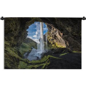 Wandkleed IJsland  - Waterval buiten een grot in Ijsland Wandkleed katoen 90x60 cm - Wandtapijt met foto