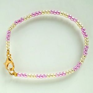 Rocaille armbandje voor de allerkleinsten - goud en roze