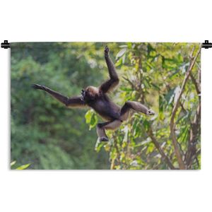 Wandkleed Junglebewoners - Springende aap in de jungle Wandkleed katoen 180x120 cm - Wandtapijt met foto XXL / Groot formaat!