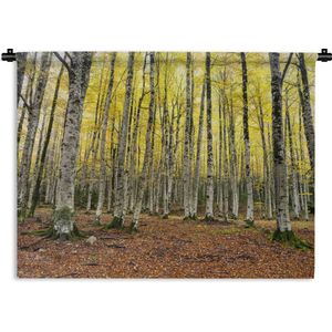 Wandkleed Bos - Gele bladeren in het bos in de herfst Wandkleed katoen 90x67 cm - Wandtapijt met foto
