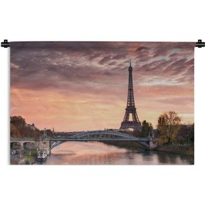 Wandkleed Eiffeltoren - Een mooie oranje lucht boven de Eiffeltoren in Parijs Wandkleed katoen 150x100 cm - Wandtapijt met foto