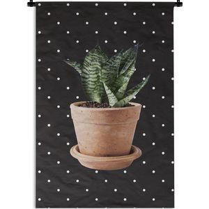 Wandkleed PlantenKerst illustraties - Plant met gestreepte bladeren voor een zwarte achtergrond met witte stippen Wandkleed katoen 60x90 cm - Wandtapijt met foto