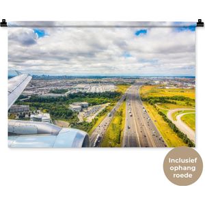 Wandkleed Landschappen Nederland - Zonnige luchtfoto van Amsterdam Wandkleed katoen 90x60 cm - Wandtapijt met foto