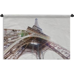 Wandkleed Eiffeltoren - De Eiffeltoren met een zonnestraal door het ijzeren geraamte Wandkleed katoen 60x40 cm - Wandtapijt met foto
