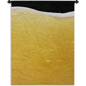 Wandkleed Bier - Close-up van een glas bier met schuim Wandkleed katoen 150x200 cm - Wandtapijt met foto