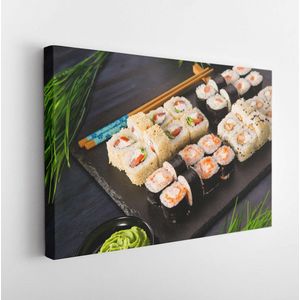 Set sushi rolt met wasabi en gember op een zwarte achtergrond. Japanse oosterse keuken - Modern Art Canvas - Horizontaal - 1667685301 - 40*30 Horizontal