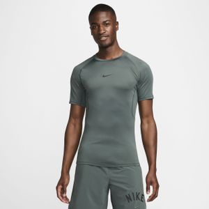 Nike Pro Dri-FIT strakke fitnesstop met korte mouwen voor heren - Groen