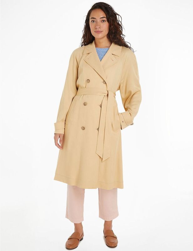 Lange, soepele trenchcoat met lange mouwen TOMMY HILFIGER. Tencel/lyocell materiaal. Maten 34 FR - 32 EU. Beige kleur