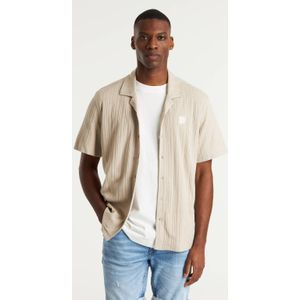 CHASIN' met ingebreid patroon beige