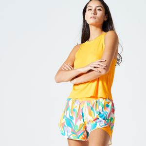 Korte damestop voor cardiofitness twee materialen loose fit oranje met print