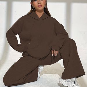 Tweedelige set voor dames, bestaande uit een kleur hoodie met trekkoord en joggingbroek met zakken, geschikt voor de herfst en winter.