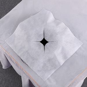 100 stuks wegwerp niet-geweven massagebedlakens met gezichtsgat - Witte geribbelde handdoek, geschikt voor schoonheidssalons en wellnesscentra