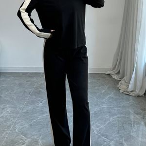 Stijlvolle zwart-wit kleurblok jumpsuit voor dames - Lange mouwen, wijde pijpen, comfortabel voor alle seizoenen, casual kleding, Casual kleding|Kleurblok jumpsuit|Jumpsuit met wijde pijpen
