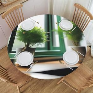 Groene planten in rond tafelkleed met patroon en patroon, waterdicht en afveegbaar met elastische randen, geschikt voor het decoreren van ronde tafels.