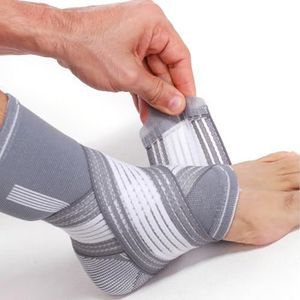 Neotech Care - Ondersteunende enkelbrace - elastische en ademende stof, verstelbare compressieband, voor mannen, vrouwen, jongeren (Grijs, 1 Stuk, Maat XL)