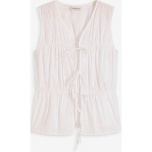 Mouwloze blouse met volants en strikjes