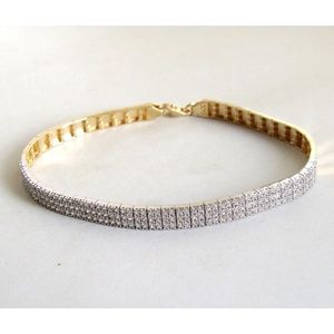 14 karaat geel- en wit gouden armband met zirkonia