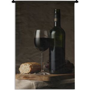 Wandkleed Rode wijn - Rode wijn en brood op een tafel Wandkleed katoen 60x90 cm - Wandtapijt met foto
