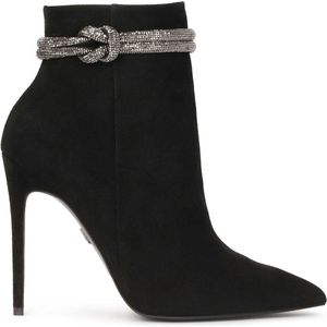 Black boots on a slender stiletto heel with a striking embellishment