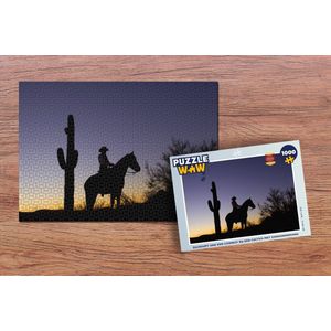 Puzzel Silhouet van een cowboy bij een cactus met zonsondergang - Legpuzzel - Puzzel 1000 stukjes volwassenen