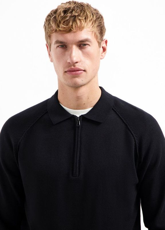 Trui met polokraag, halve rits en raglanmouwen