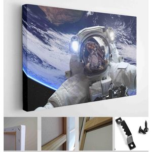 Astronaut in outer space against the backdrop of the space planet. Elements of this image furnished by NASA - Modern Art Canvas - Horizontal - 285316604 - 80*60 Horizontal