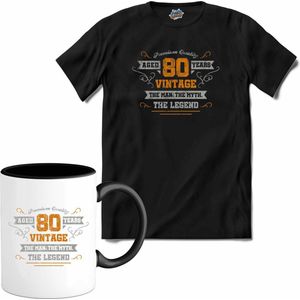 80 Jaar vintage legend - Verjaardag cadeau - Kado tip - T-Shirt met mok - Dames - Zwart - Maat XL