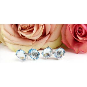 Oorringen in wit goud gezet met blauwe topaas en diamant