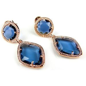 Zilveren oorringen oorbellen roos goud verguld Model Tango met blauwe stenen