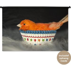 Wandkleed Dieren op een zwarte achtergrond - Oranje vogel in een cupcake op zwarte achtergrond Wandkleed katoen 120x80 cm - Wandtapijt met foto