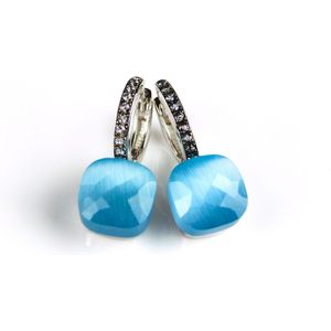 Zilveren oorringen oorbellen model pomellato gezet met lichtblauwe steen